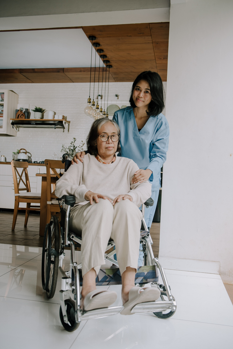 Nurse Taking Care of an Elderly Woman 